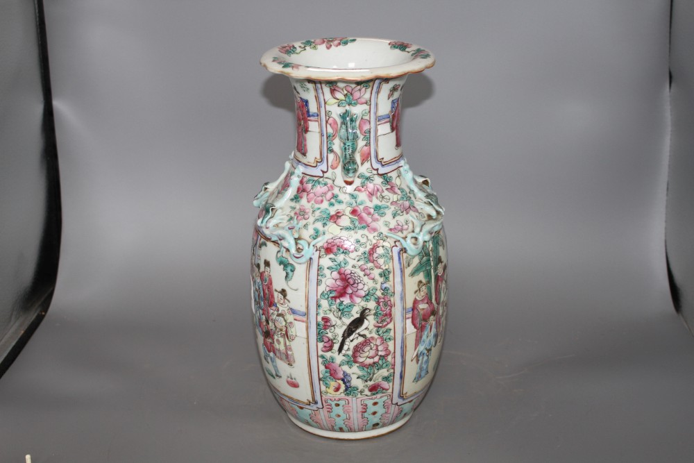 A 19th Chinese famille rose vase, decorated with panels of noblemen and attendants, height 35cm